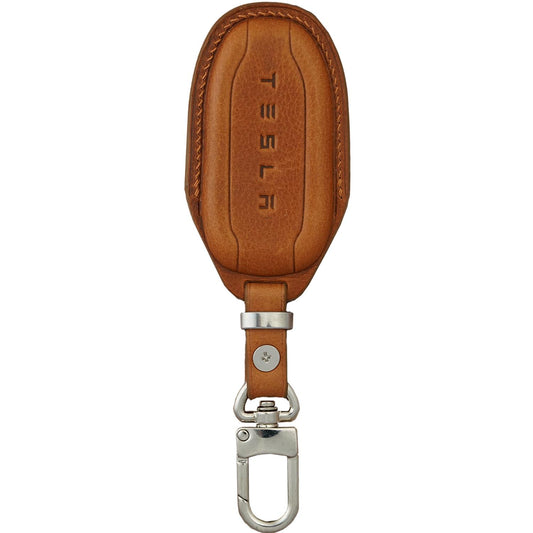 Brown Vachetta leather Tesla key fob cover with silver hardware and embossed "TESLA" logo.