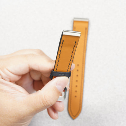 Close-up of the stainless-steel end insert on the VGreen Cartier Santos Galbée strap, held in hand.