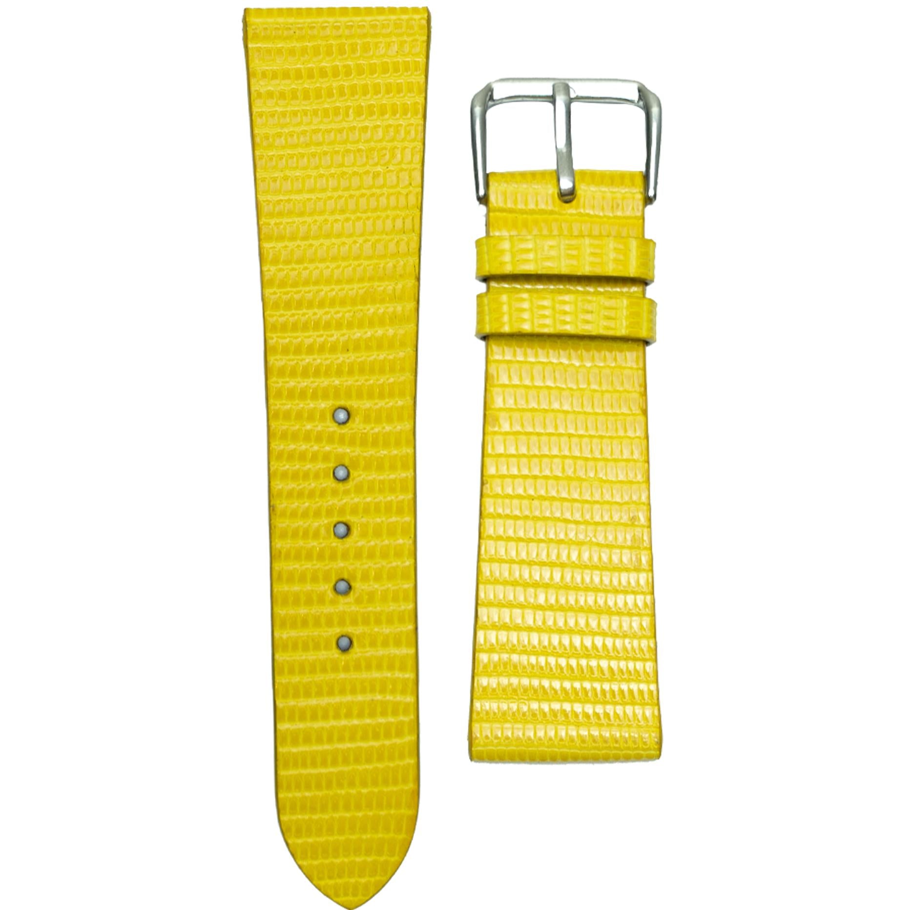 Yellow lizard leather watch strap with silver buckle, flat lay.