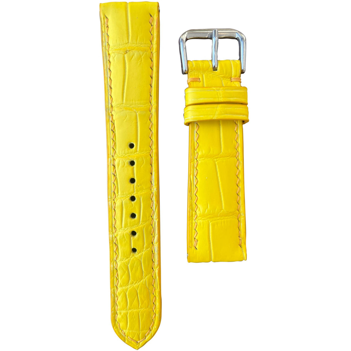 Yellow crocodile leather watch strap with matching stitching and silver buckle, flat lay.