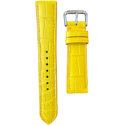 Yellow crocodile leather watch strap with matching stitching and silver buckle, flat lay.